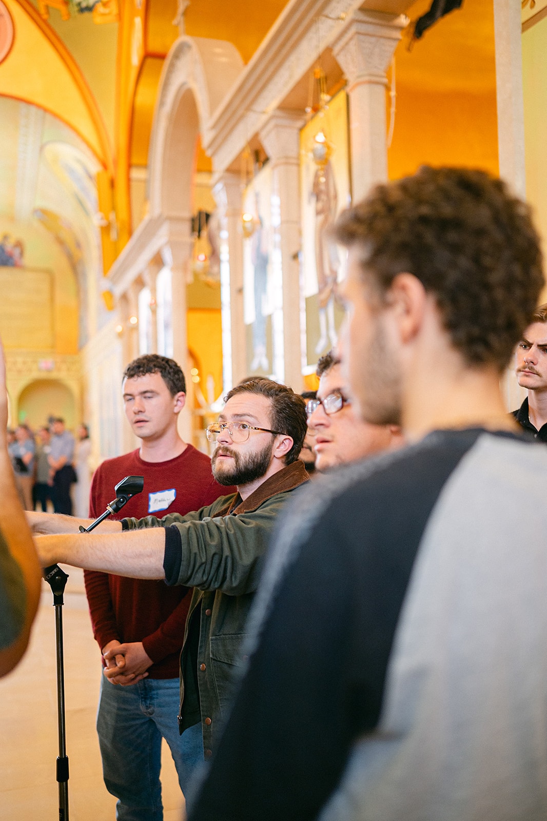 Young chanters working through a hymn at the stand during instruction